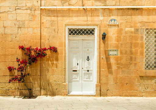 Valetta building entrance, bougainvillea, ancient stone