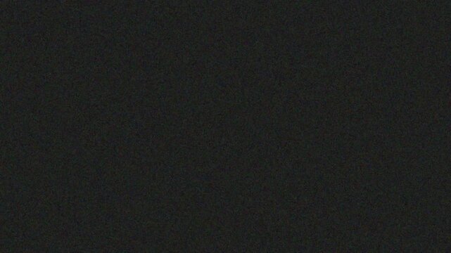 A plain black background with a subtle texture, perfect for overlaying text or graphics.