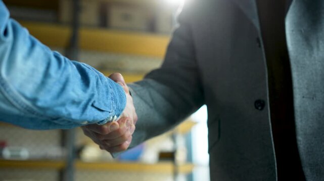 handshake between colleagues in a business office setting