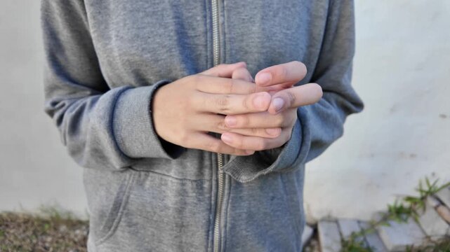Close-up of children's hands moving anxiously. Mental health concept. Neurodivergence