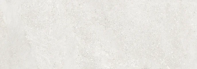 White terrazzo texture with natural stone particles and beach sand inspired earthy surface pattern. Rustic architectural background with warm neutral tones. © Vidal