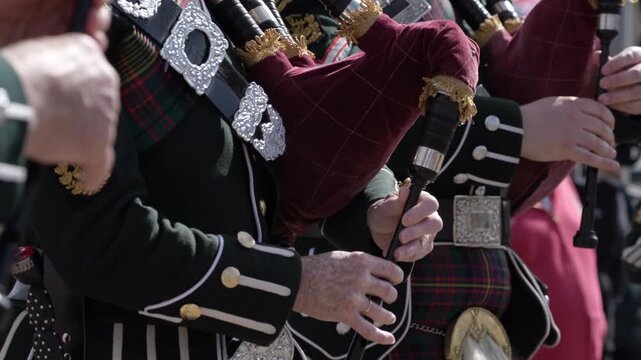 Scottish bagpiper playing traditional Bagpipes