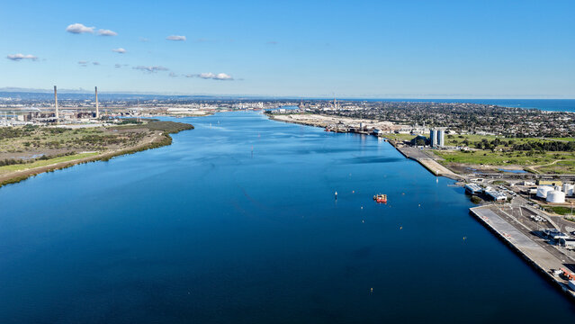 Osborne, Adelaide, South Australia &ndash; 4K aerial drone view of Port Adelaide River, Torrens Island, industrial waterfront, ASC Shipyard, maritime facilities and coastal wetlands