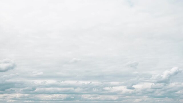 Timelapse 4k storm dramatic clouds are floating across the sky. Stormy sky with dark, snowy clouds on a spring day. Clouds are floating across the sky. Dark blue clouds swiftly floating across sky. 
