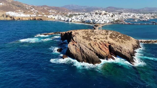 Portara monument from sea level, Naxos, Greece. Aerial drone 4K video