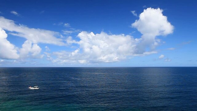 万座毛の海と青空と本部半島と積乱雲