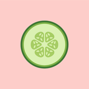 A fresh green cucumber slice on a pink background