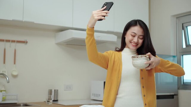 Woman creating live social media content with a smartphone while promoting Japanese matcha tea in live commerce, creator or influencer marketing on healthy beverage and modern online business.
