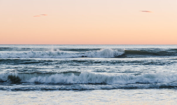 Beautiful sunset at sea, seascape with waves Italy.