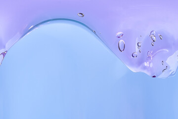 Purple translucent bubble wave on a soft blue background, flowing abstract shape, minimal composition, copy space © Yevhenii Khil