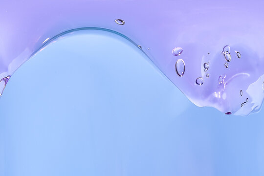 Purple translucent bubble wave on a soft blue background, flowing abstract shape, minimal composition, copy space