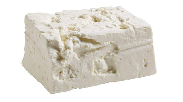 Block of crumbly white feta cheese with rough texture