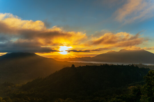 Golden Morning Light Over Gunung Batur Mountains and Tropical Valley