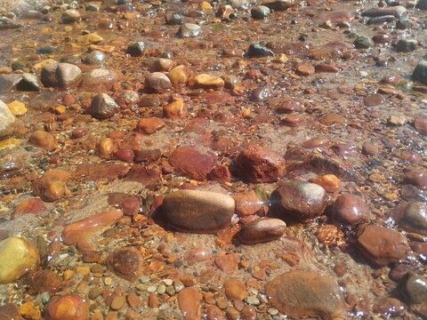 Rusty stones on the Baltic beach in Latvia