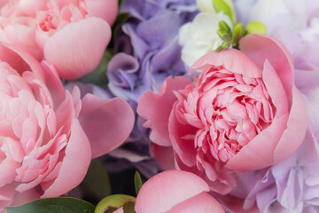 Macro shot of beautiful pink peony flower in a delicate floral bouquet © Ruslan