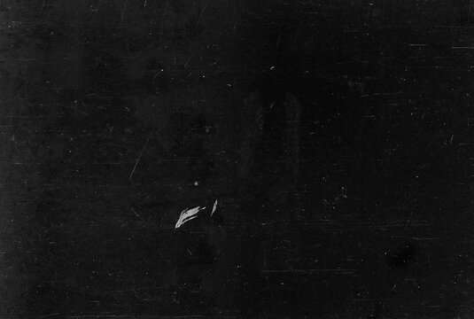 Dusty scratched and scanned old film texture, light leaks overlay effect. Retro analog cinematic flare. 