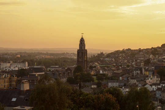 Shandon steeple dominating cork city skyline at sunset