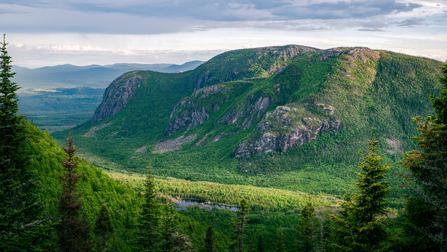 Warm sunset light over wonderful mountains of ZEC des martres and its lush foliage, Dome mountain, Charlevoix, QC, Canada