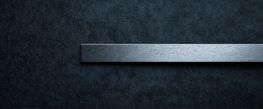 Metal bar on textured dark surface
