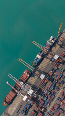 Fototapeta premium Aerial view from a container drone. Container ships in export-import and logistics business Transporting goods to large ports Worldwide shipping and logistics business International business abroad