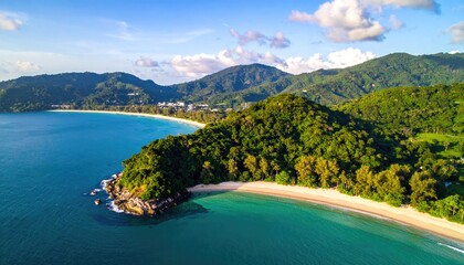 Obraz premium Lush green coastline meets turquoise waters, with rolling hills in background