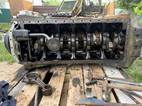 Disassembled engine crankcase revealing crankshaft and internal components