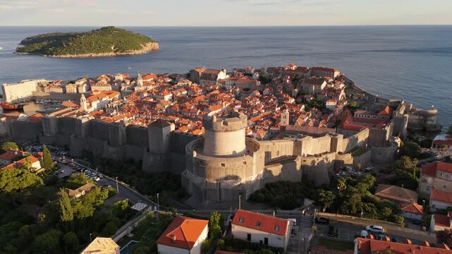 Dubrovnik old town aerial establishing shot of the round tower (Tvrdava Minceta) and walls