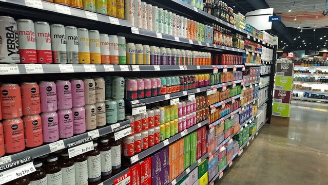 A wide selection of beverages on grocery store shelves