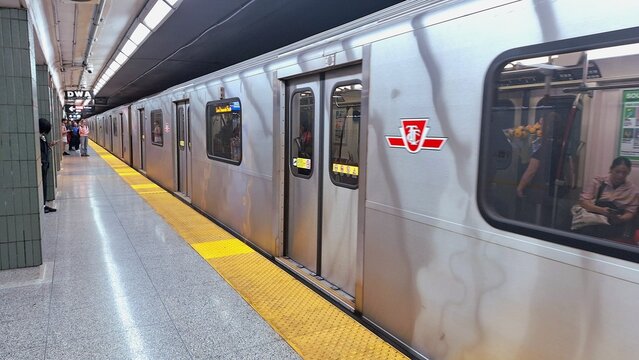 Modern subway train arriving at a Toronto underground station