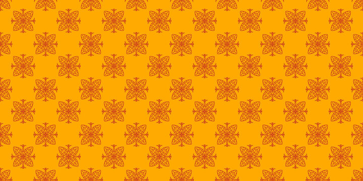 Seamless batik pattern with orange background and red traditional ornaments.