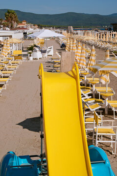 yellow floating slide in Follonica, Tuscany, Italy