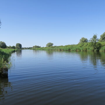 Beautiful, peaceful natural landscape with a river and sky.