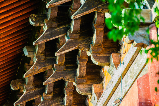 Datong, China - May 9 2026: Elaborate dougong structure in Sanhua Temple demonstrates sophisticated interlocking wooden brackets supporting layered roofs with refined ancient Chinese architecture