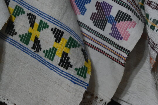 Close-up of traditional multicolored folk embroidery detail on fabric.