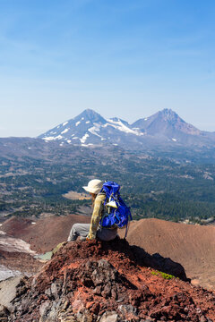 faceless Backpacker sitting edge nature oregon mountain peaks s