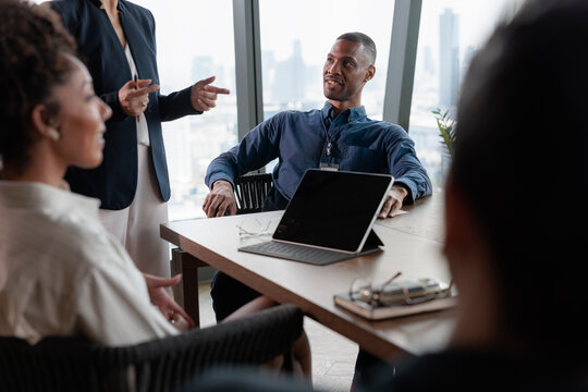 Team meeting with attentive colleague in modern office