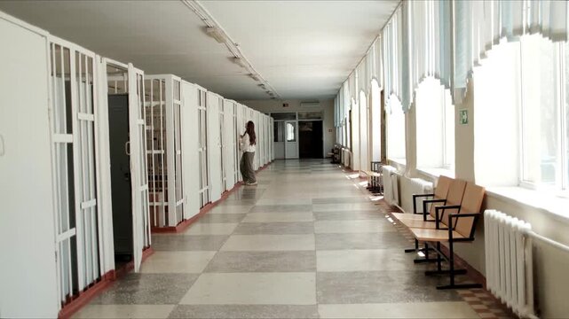 Walking through an empty corridor of an old school building with natural light. Ideal for education, school architecture, academic life, nostalgia, public institutions, and educational environment 