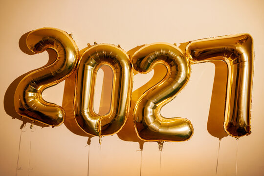 New Year 2027 Golden Balloons on Beige Background