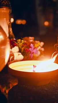 Candle Lit In Memory Of The Departed At Night On The Grave vertical video