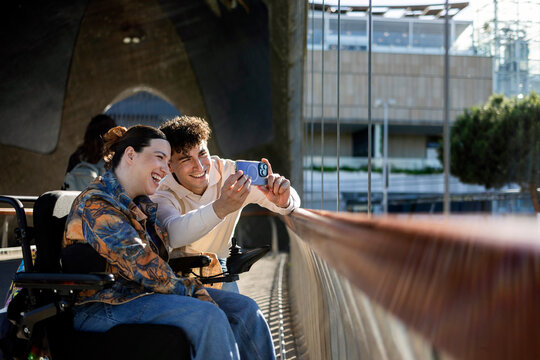 Young friends enjoying moment taking selfie outdoors