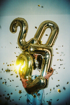 Smiling Woman Celebrates New Year 2027 with Balloons Film Photo