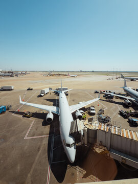 Passenger Airplane on Busy Airport Apron
