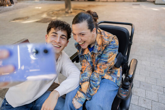 Diverse friends capturing joyful selfie moment outdoors