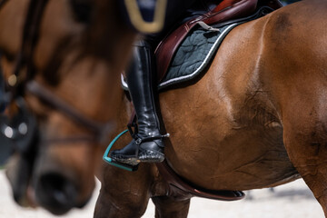 Obraz premium Equestrian Rider Leg Position and Horse Detail