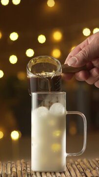 Double Espresso Pouring Into Milk For Iced Latte
