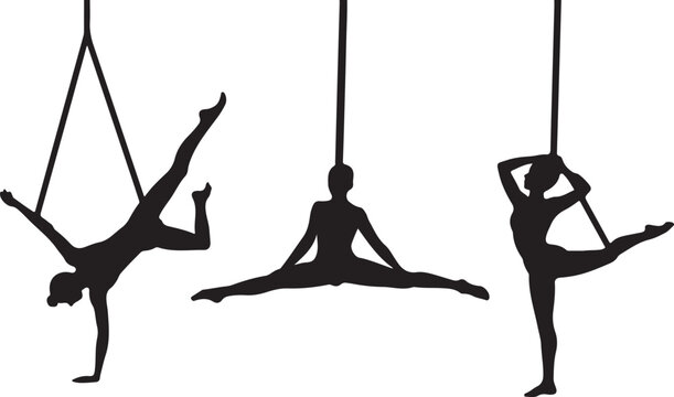 Aerial yoga poses with silk straps