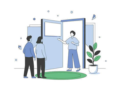 Two people look at a screen while a greeter welcomes them with open arms and a plant indoors