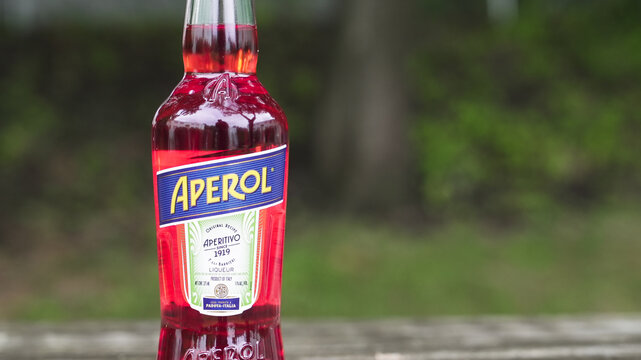 NORWALK, CT, USA - JUNE 26, 2026: Aperol bottle standing outdoors, displaying its iconic orange liqueur