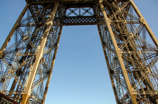 The metal structure of the Eiffel Tower is a landmark of 19th-century engineering. Paris, France