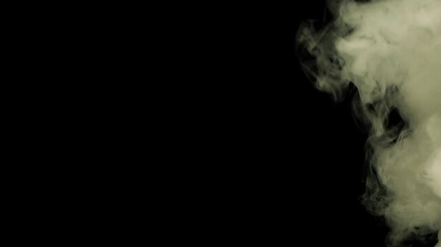 4K VFX Element practical atmospheric smoke. Abstract dense haze mist smoke cloud. Smoke in slow-motion floating through space against black. Mist effect. Fog effect. Haze and vapor action element.